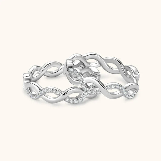 Silver infinity loop earrings with twisted rope links and small clear stones