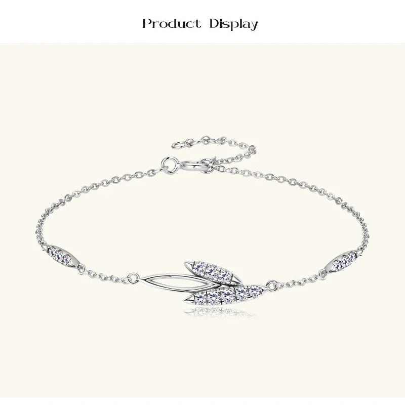 Silver-tone moissanite bracelet with leaf-shaped center and pavé side stones
