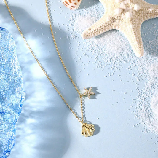 Gold starfish and sea shell CZ pendant necklace with thin chain