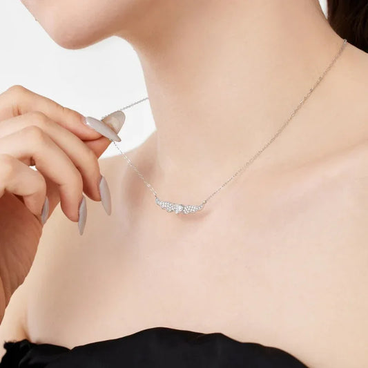 Angel wings heart CZ pendant necklace with pink center stone on white gold chain