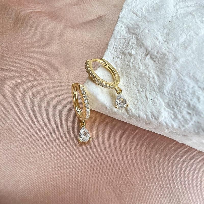 Gold teardrop diamond hoop earrings with pavé hoop and dangling teardrop crystal