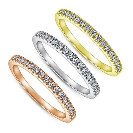 Set of three diamond stacking rings in gold, silver, and rose tones