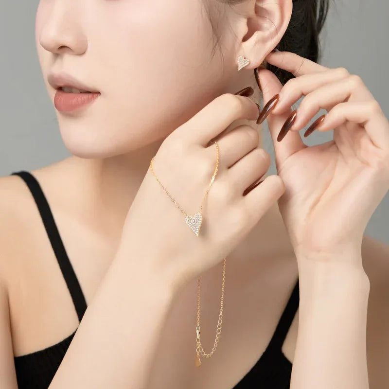 Heart-shaped CZ pendant necklace with gold tone chain and white pavé stones
