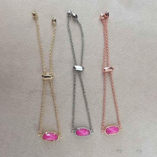 Set of beaded chain bracelets with oval stones in gold-tone, silver-tone, and rose-tone.