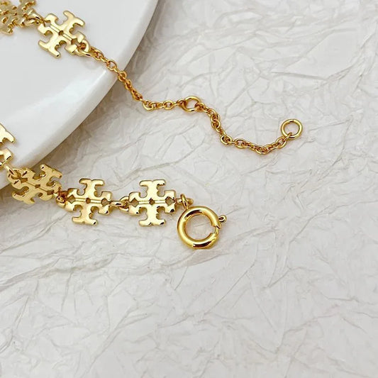 Gold link bracelet with chain clasp and circular toggle at end