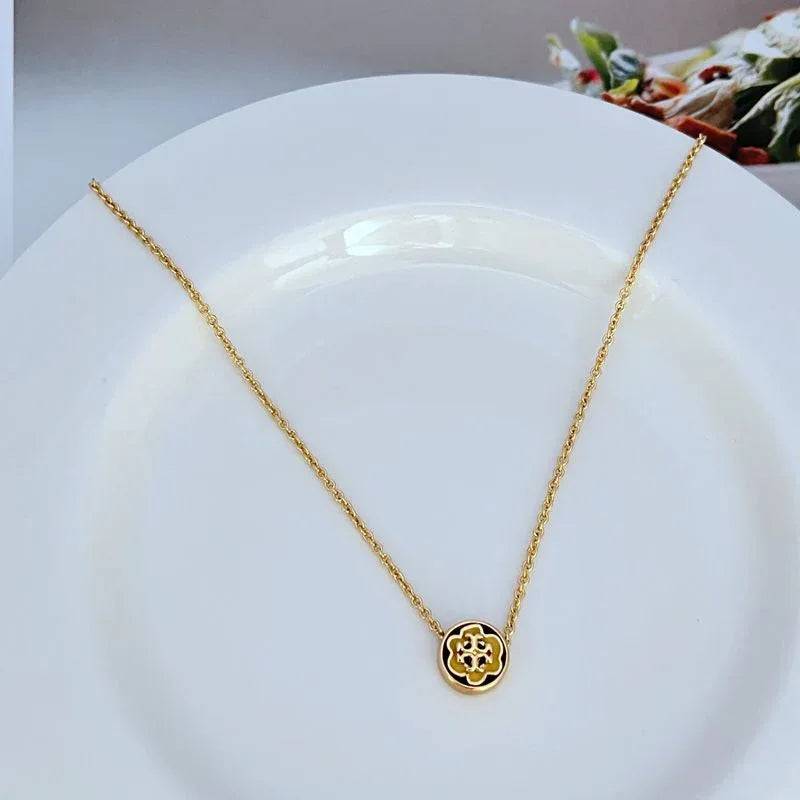 Gold-tone round enamel flower pendant necklace with adjustable chain and clasp