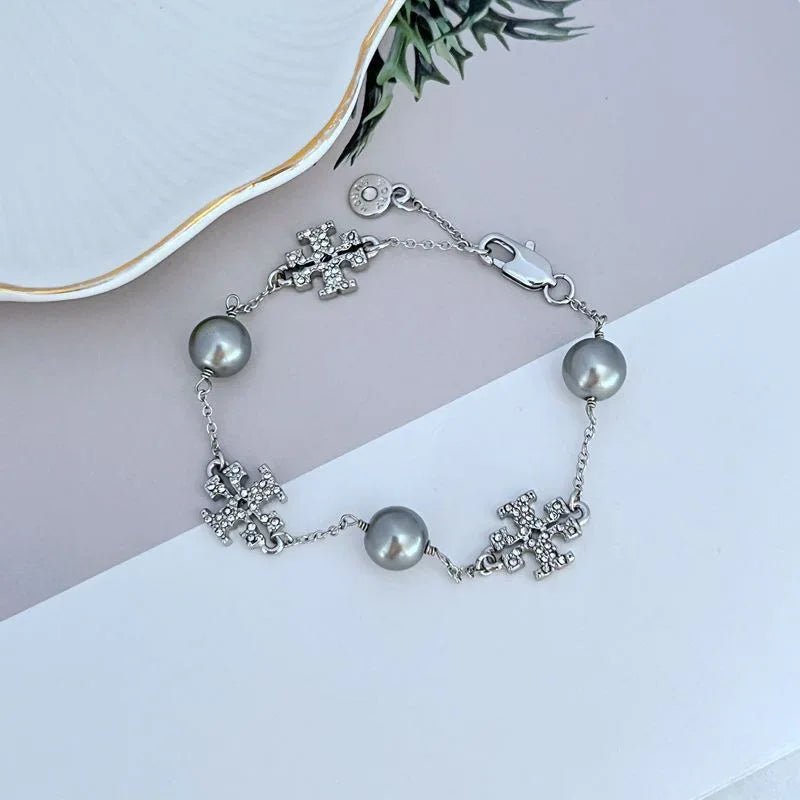 Silver rhinestone pearl bracelet with cross charms and gray pearl beads