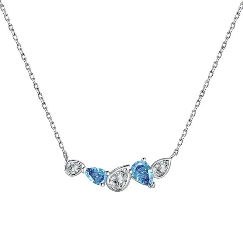 Silver heart CZ pendant necklace with blue stones and clear side stones on chain