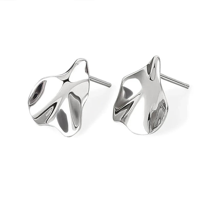 Silver-tone abstract stud earrings with straight post backs.