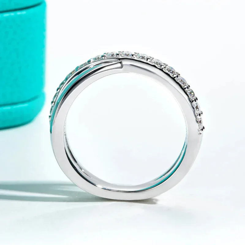 Silver-tone moissanite band ring with round stones set around the outer edge