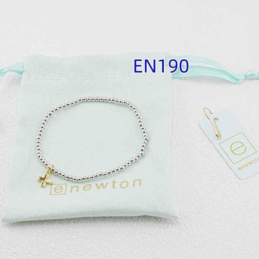 Silver beaded cross pendant bracelet with gold cross charm, side view