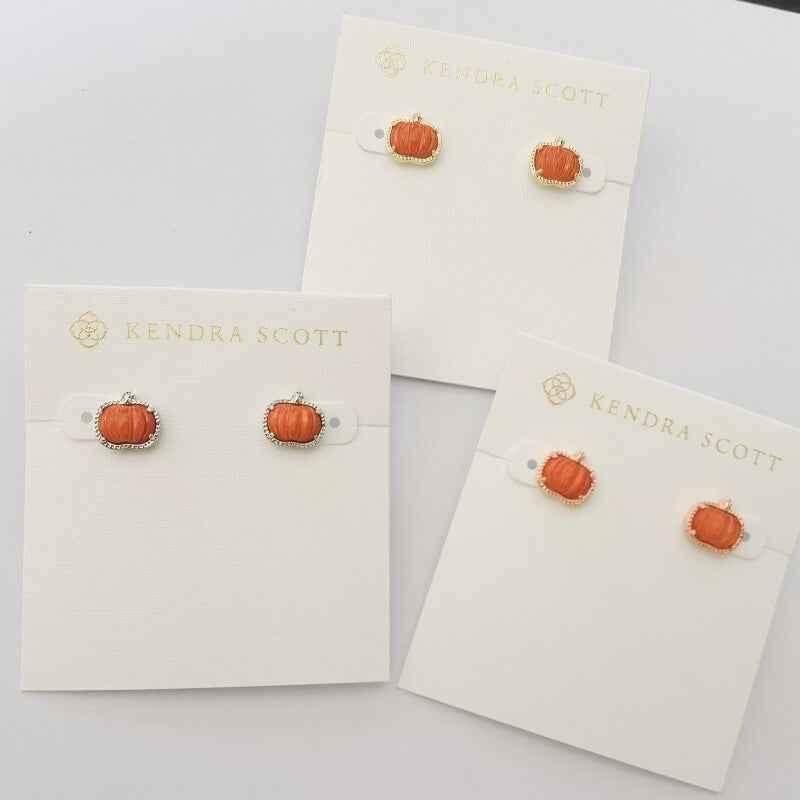 Pumpkin stud earrings with orange center and gold-tone setting
