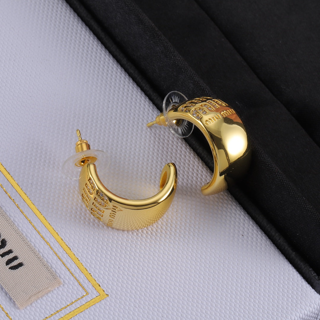 Gold glossy C-shaped hoop earring with logo front panel and stud detail