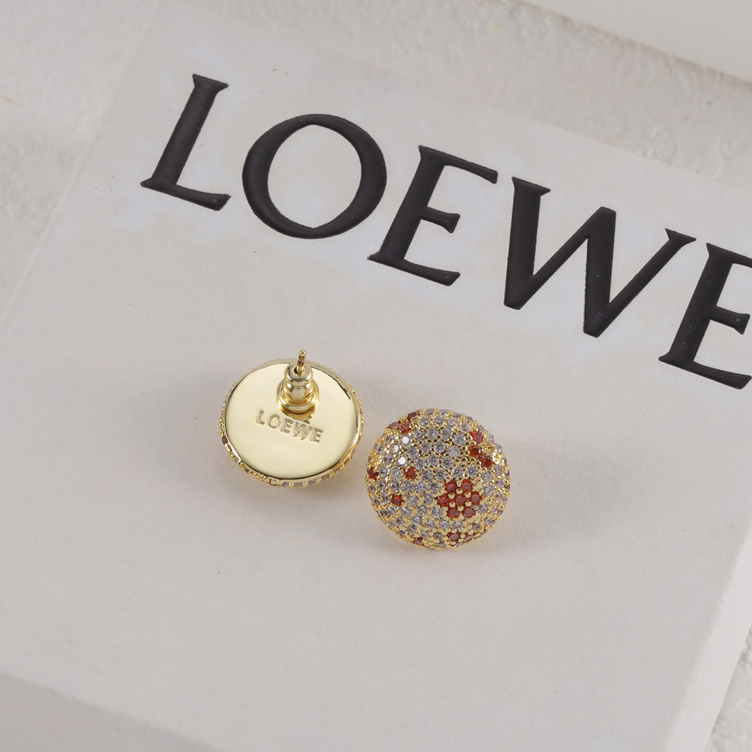 Round gold-tone diamond stud earring with red flower accents and visible LOEWE back plate.