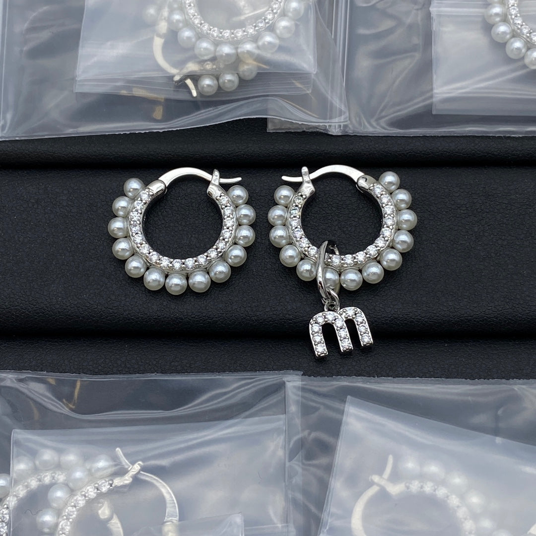 White gold pearl and crystal hoop earrings with dangling letter charm