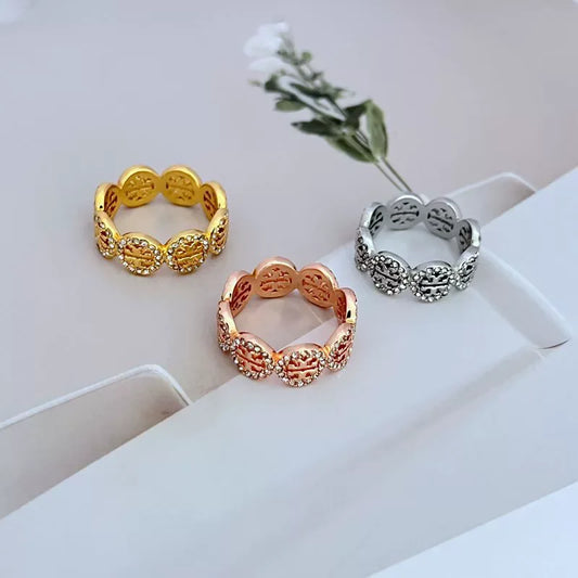 Logo cutout ring set with gold-, rose gold-, and silver-tone styles
