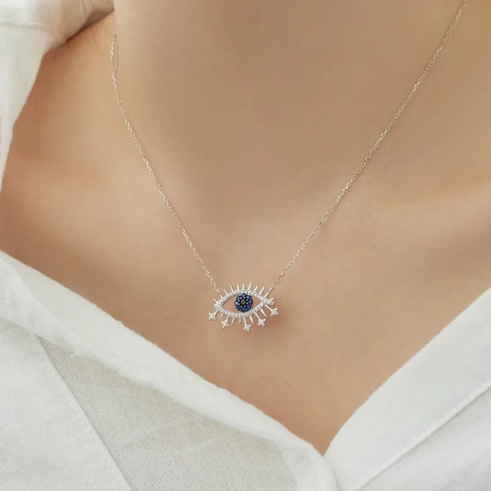 Evil eye pendant necklace, silver tone with blue center CZ and spiked detailing
