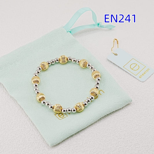 Elastic gold bead bracelet, alternating ridged gold beads with tiny silver beads