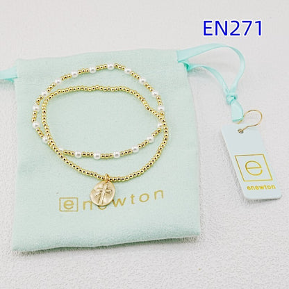 Pearl and disc cross pendant bracelet set, gold-tone beads with white pearls and charm