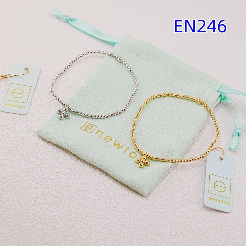 Set of two elastic beaded cross pendant bracelets in gold and silver bead tones