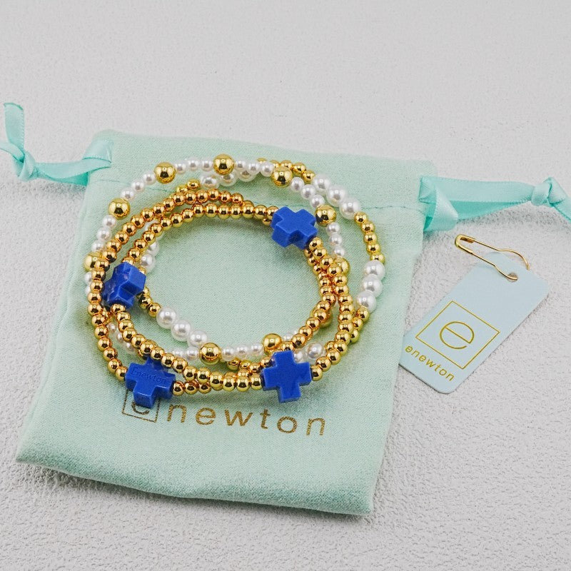 4-piece pearl and gold beaded stackable bracelets with blue cross charms