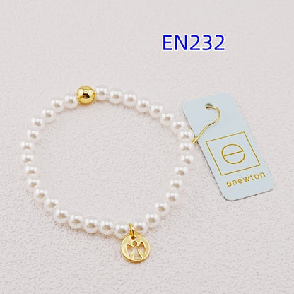 White pearl bead bracelet with gold accent bead and gold paw-print charm
