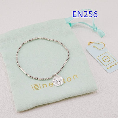 Silver-tone beaded bracelet with heart disc cross pendant, single link chain style