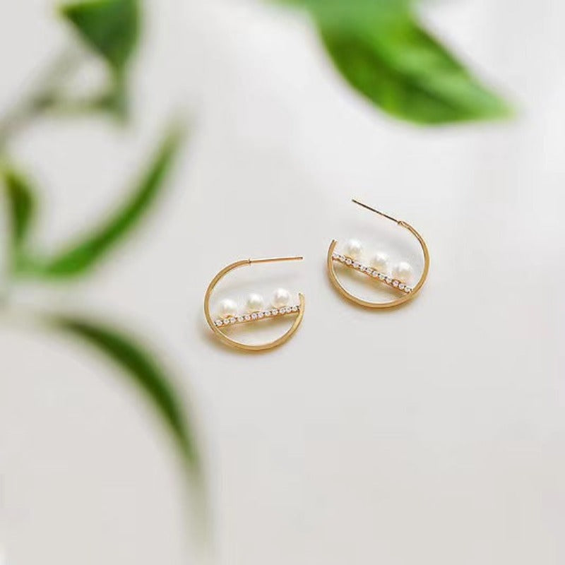 white pearl earrings hanging