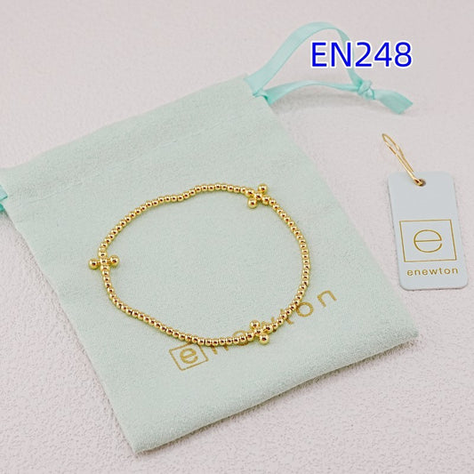 Gold minimalist cross elastic beaded bracelet with round beads and small cross charms