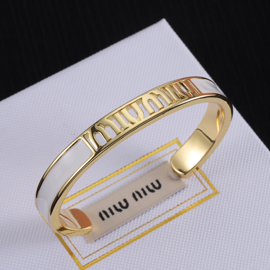 Miu Miu enamel openwork logo bangle, gold-tone cuff with white enamel panels