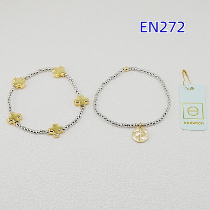 Pair of silver beaded cross bracelets with gold charms and round coin pendant.