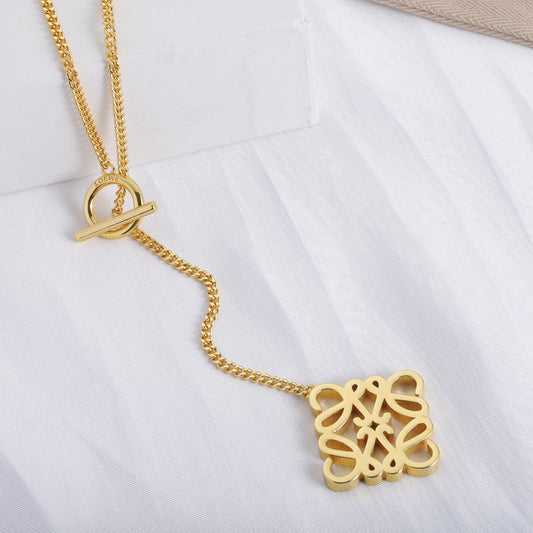 Gold square cutout logo pendant with toggle clasp and chain