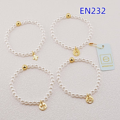 White pearl bead bracelets with gold accent beads and assorted gold charms