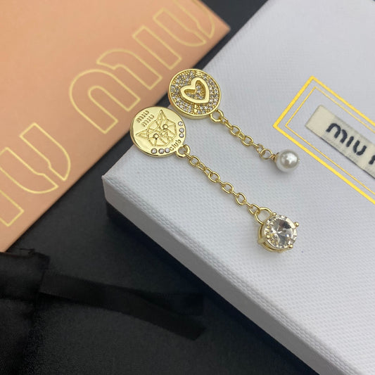 Gold earrings with pavé heart studs, pearl bead tassel, clear crystal drop