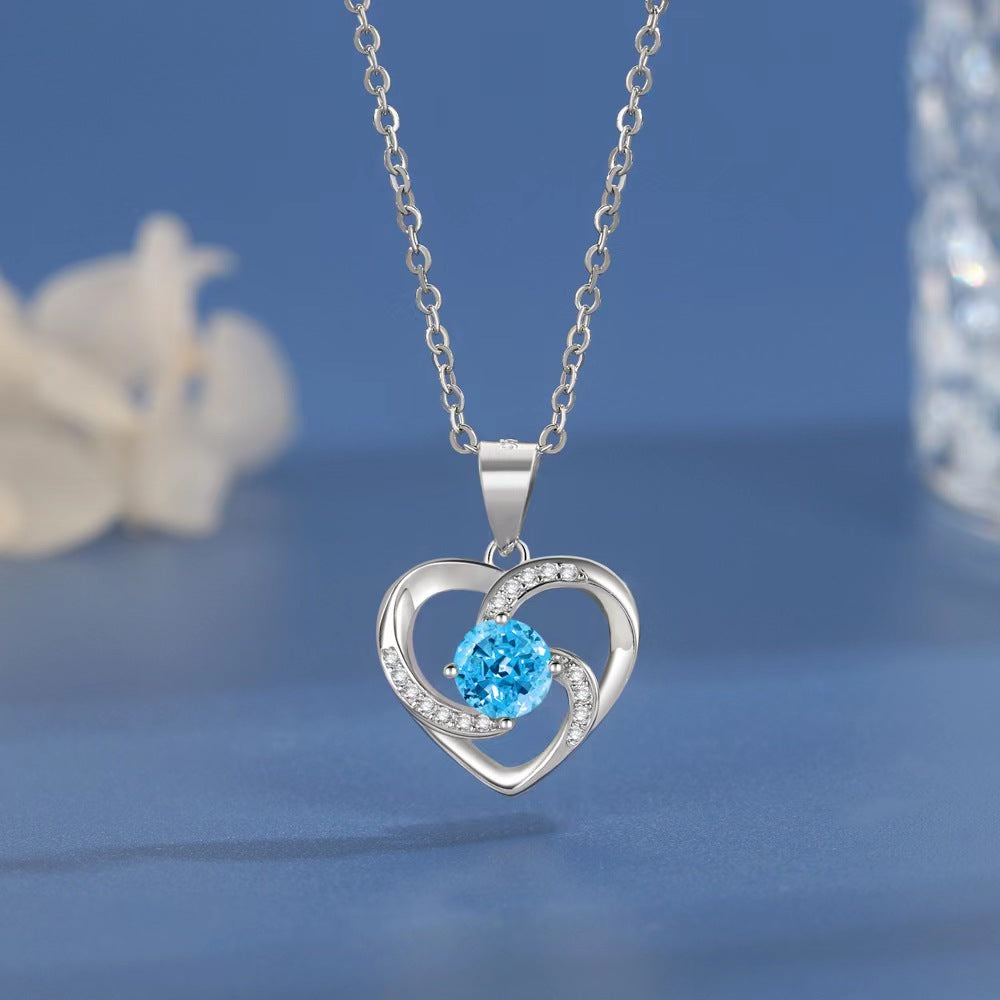 silver heart pendant with colorful diamond