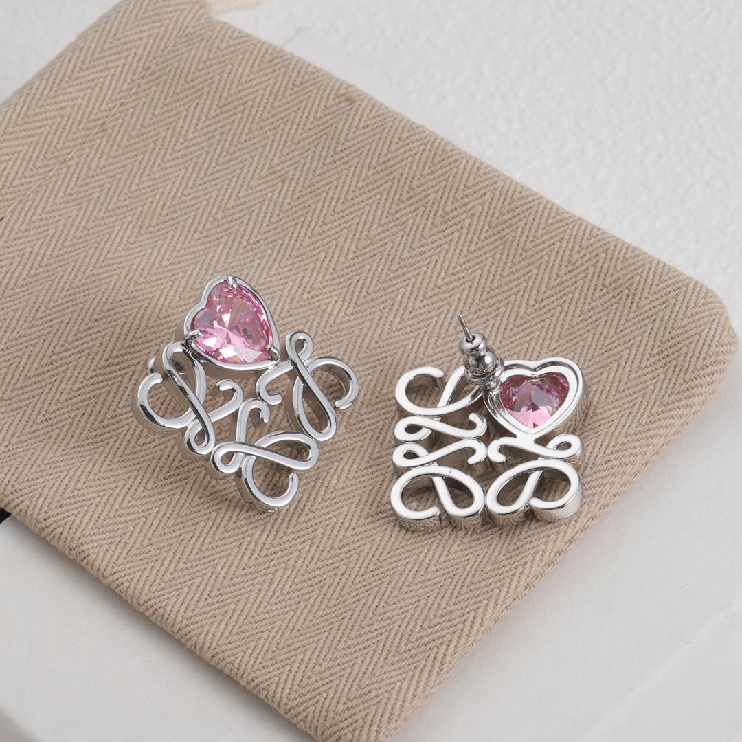 Heart stud earrings with silver-tone filigree and pink heart zircon centers