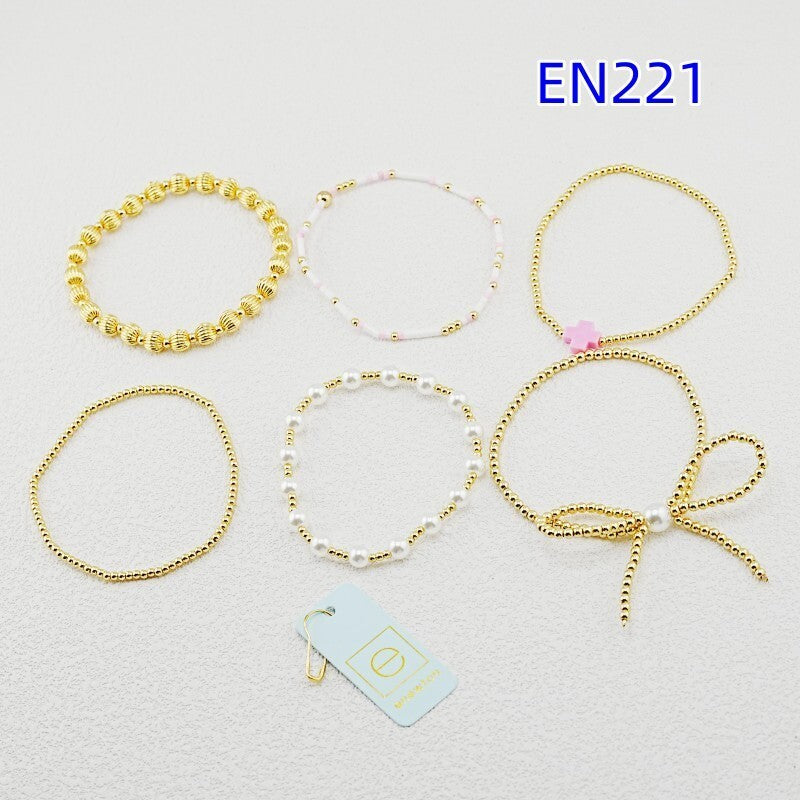 Bracelet set of six gold-tone beaded strands with faux pearls and pink bead accents
