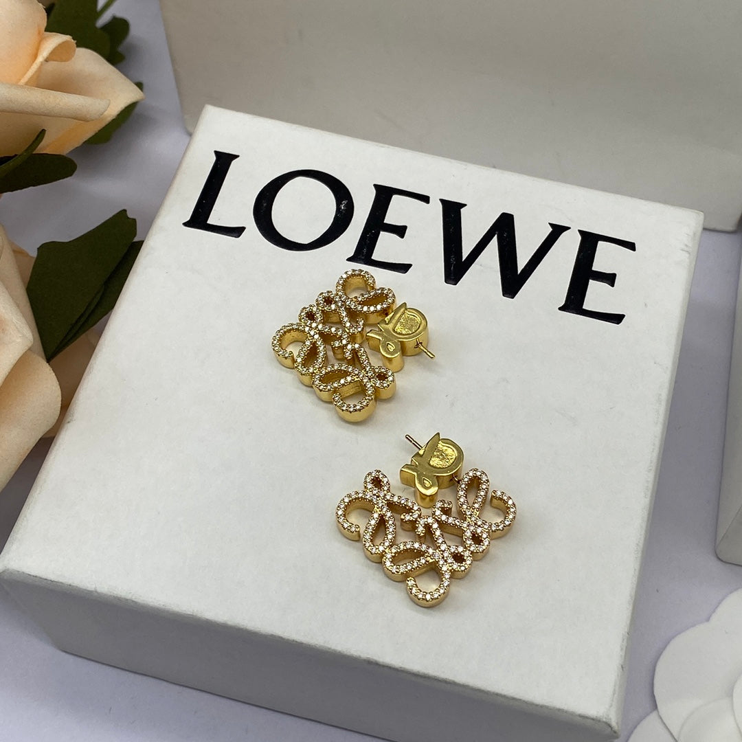 Gold geometric hollow diamond stud earrings with four-lobed clover cluster posts