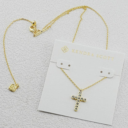 Gold cross pendant necklace with round diamond-studded cluster design and link chain