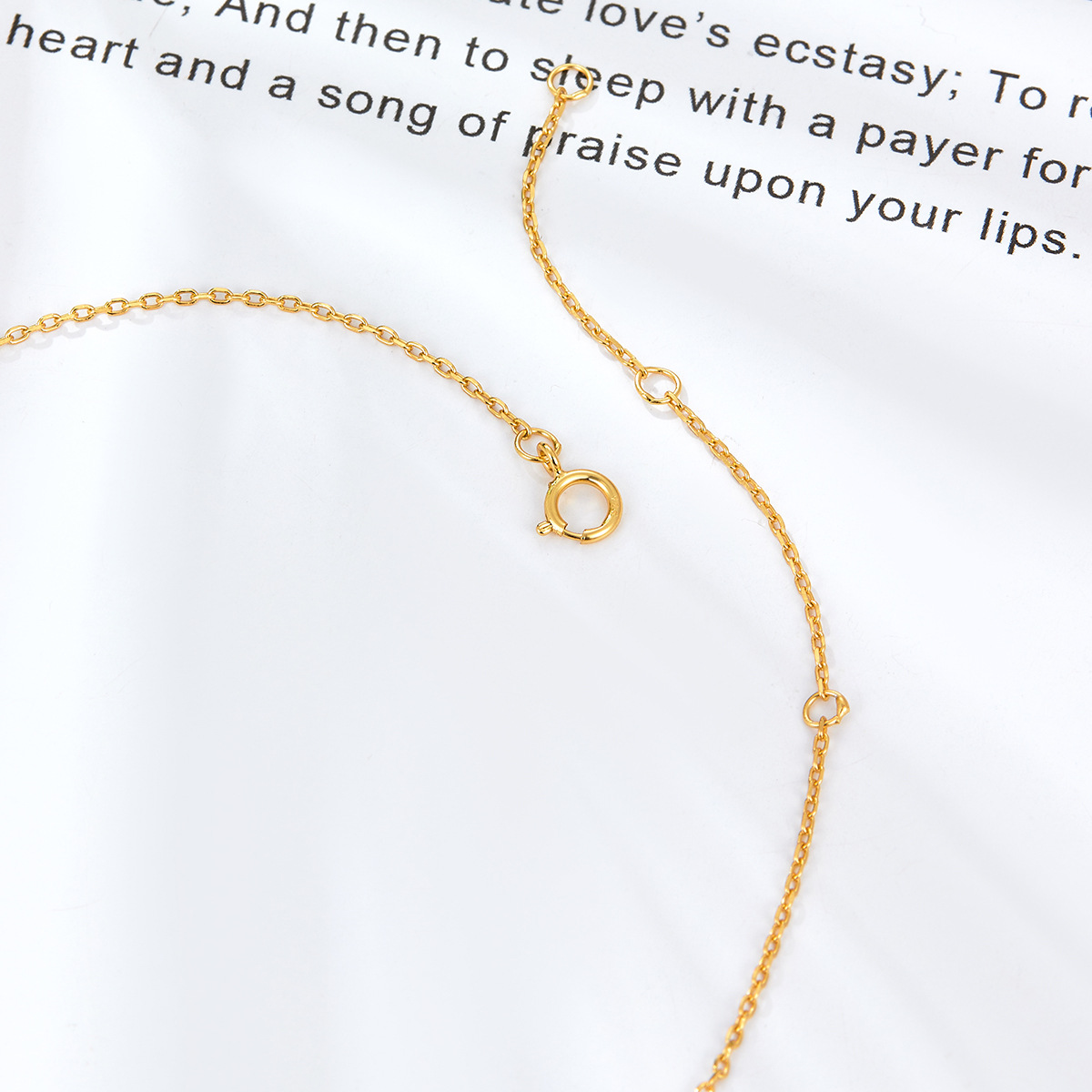 Gold-tone chain necklace with lobster clasp and link loops