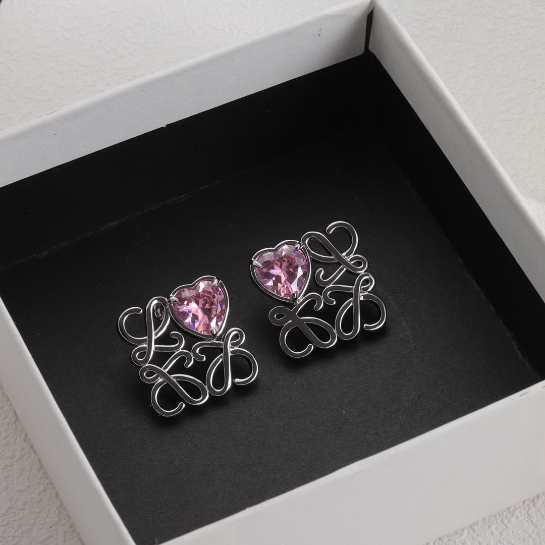 Heart stud earrings with silver-tone openwork frame and pink zircon centers