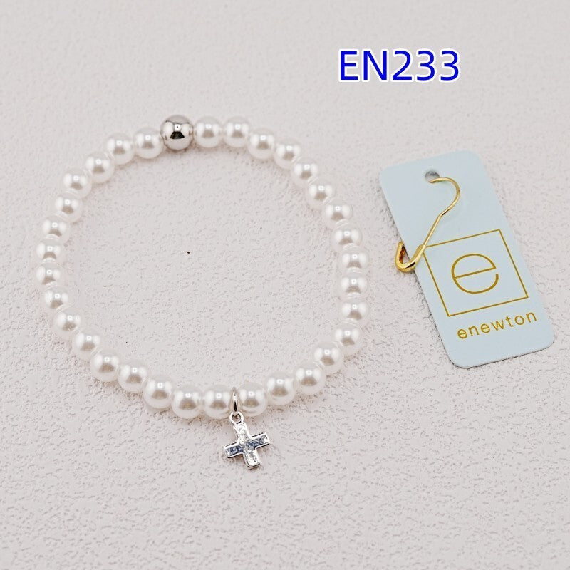 Pearl strand bracelet with silver cross pendant charm and white pearl beads