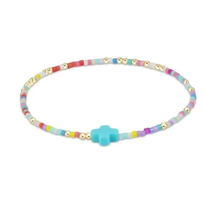 Colorful glass bead bracelet with blue cross charm and gold-tone spacer beads