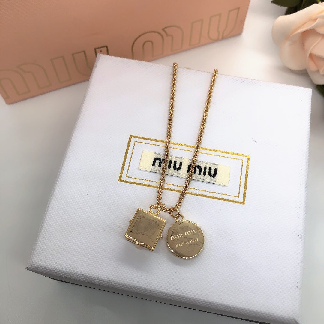 Miu Miu gold-tone pendant necklace with square tag charm and round disc charm