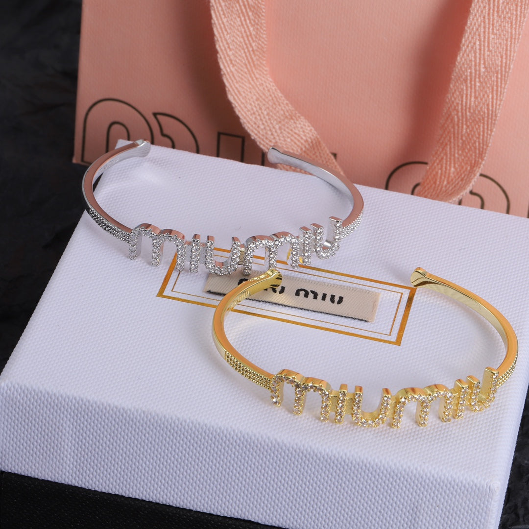 White-gold & gold open bangles with diamond-studded rows