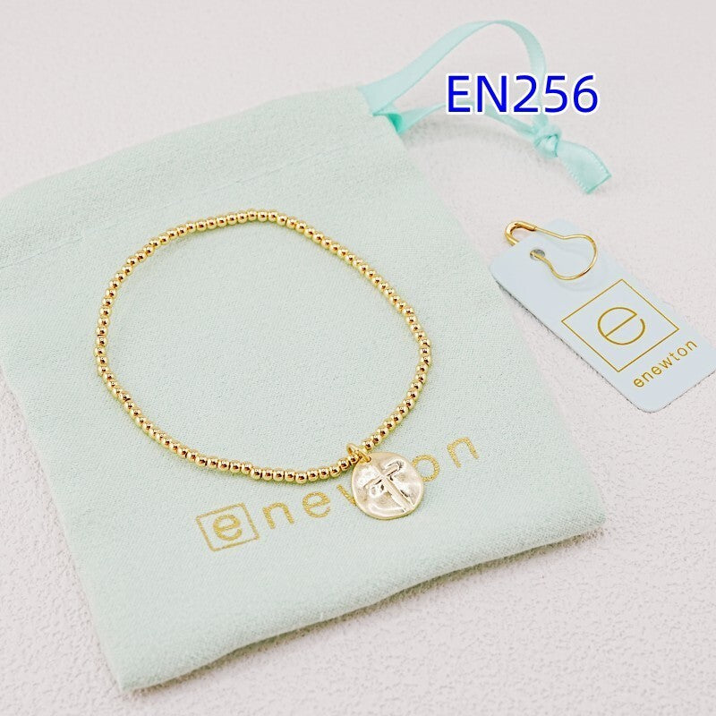 Gold-tone beaded bracelet with heart disc cross pendant and small clasp links
