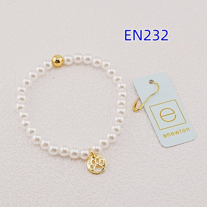 White pearl bead bracelet with gold accent bead and gold paw-print charm
