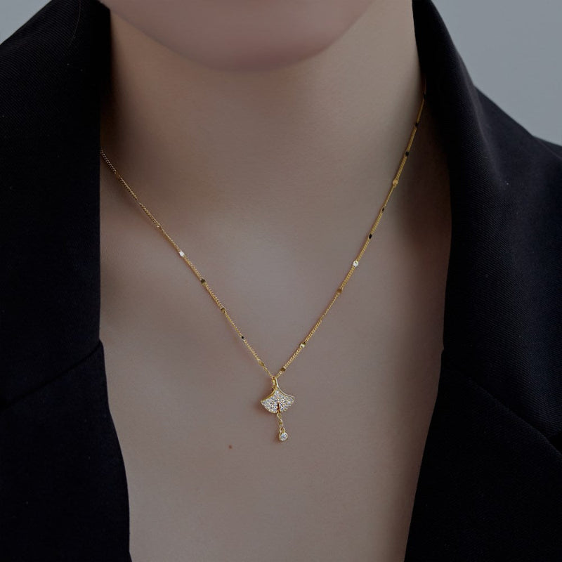 Pretty Gold Fan with Dangling Stone

