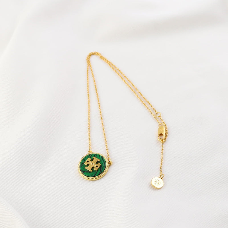 High-End Tory Burch Circle Pendant


