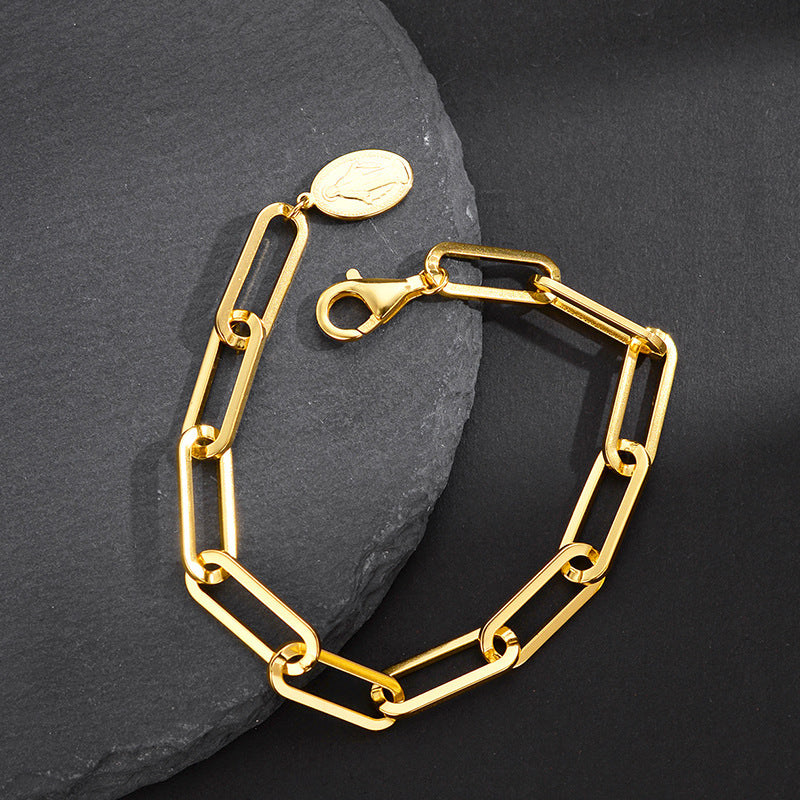Minimalist Gold Chain Bracelet with Religious Symbol

